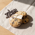 Almost Calm cookies wrapped with twine, chocolate alongside